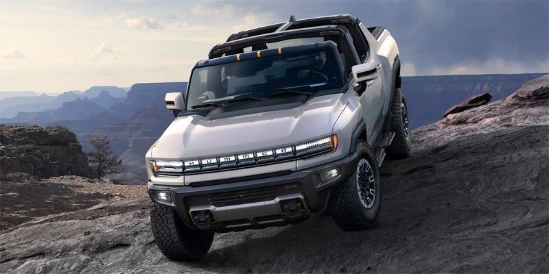 2024 GMC HUMMER EV Pickup standing on hill
