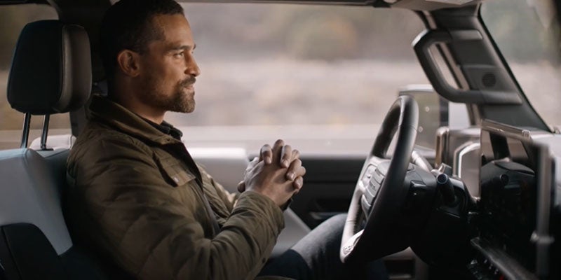 Person driving 2024 GMC HUMMER EV Pickup